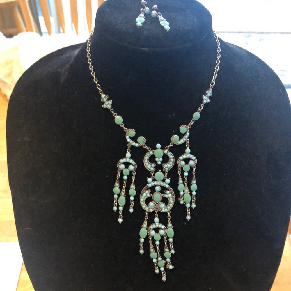 Statement necklace . Turquoise look stones and matching earrings.